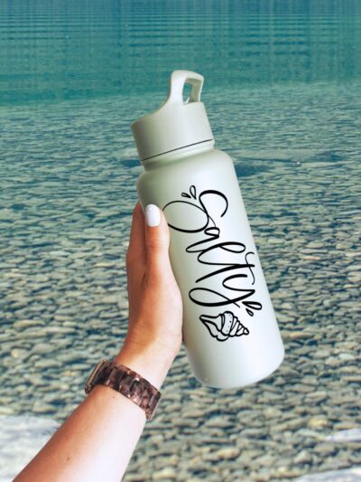 Salty! Hand Lettered SVG File on waterbottle in front of lake