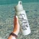 Salty! Hand Lettered SVG File on waterbottle in front of lake