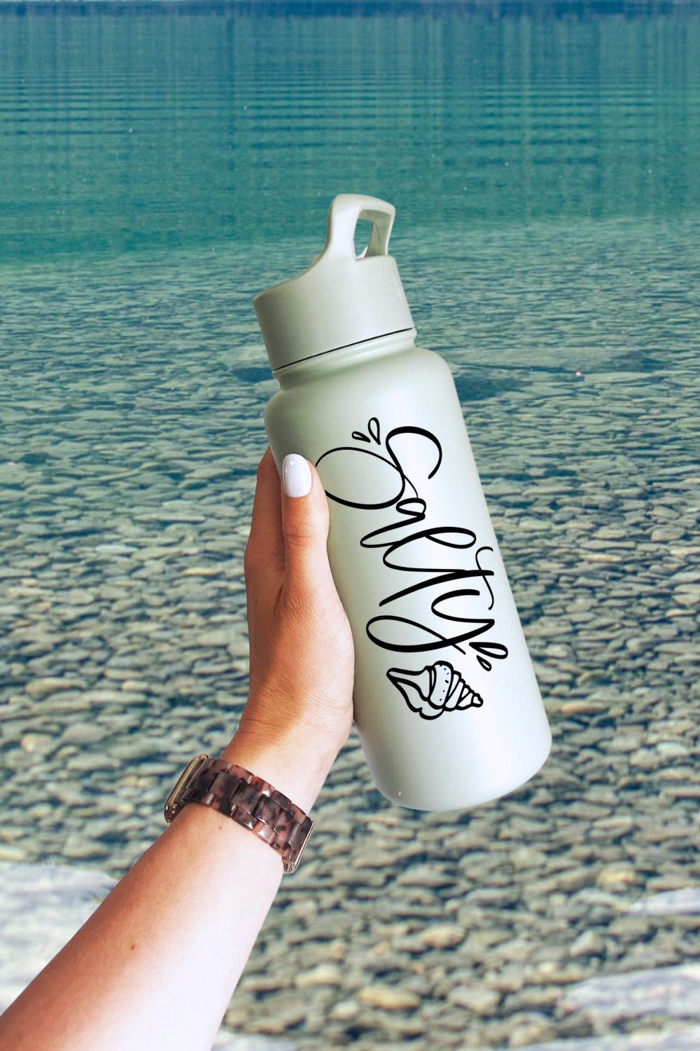 Salty! Hand Lettered SVG File on waterbottle in front of lake