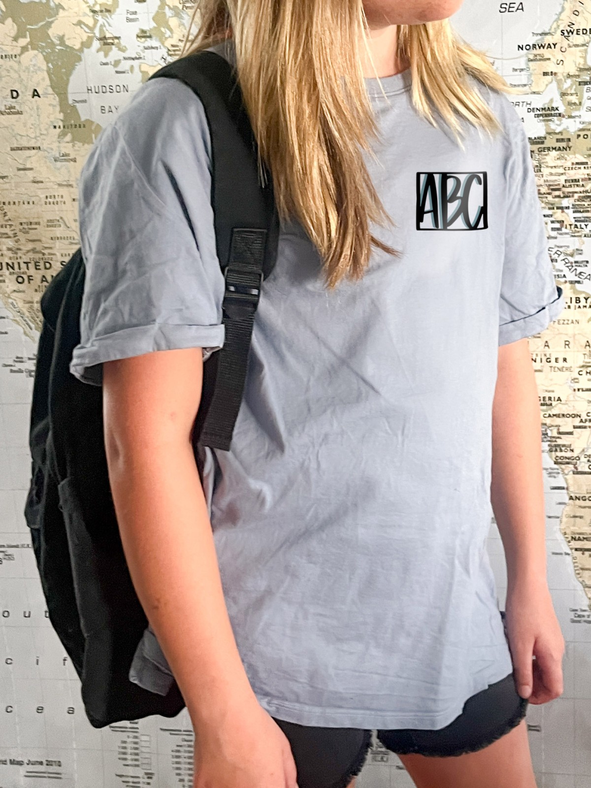 ABC vinyl transfer on pocket area of a plain blue tee (free SVG design in this post)