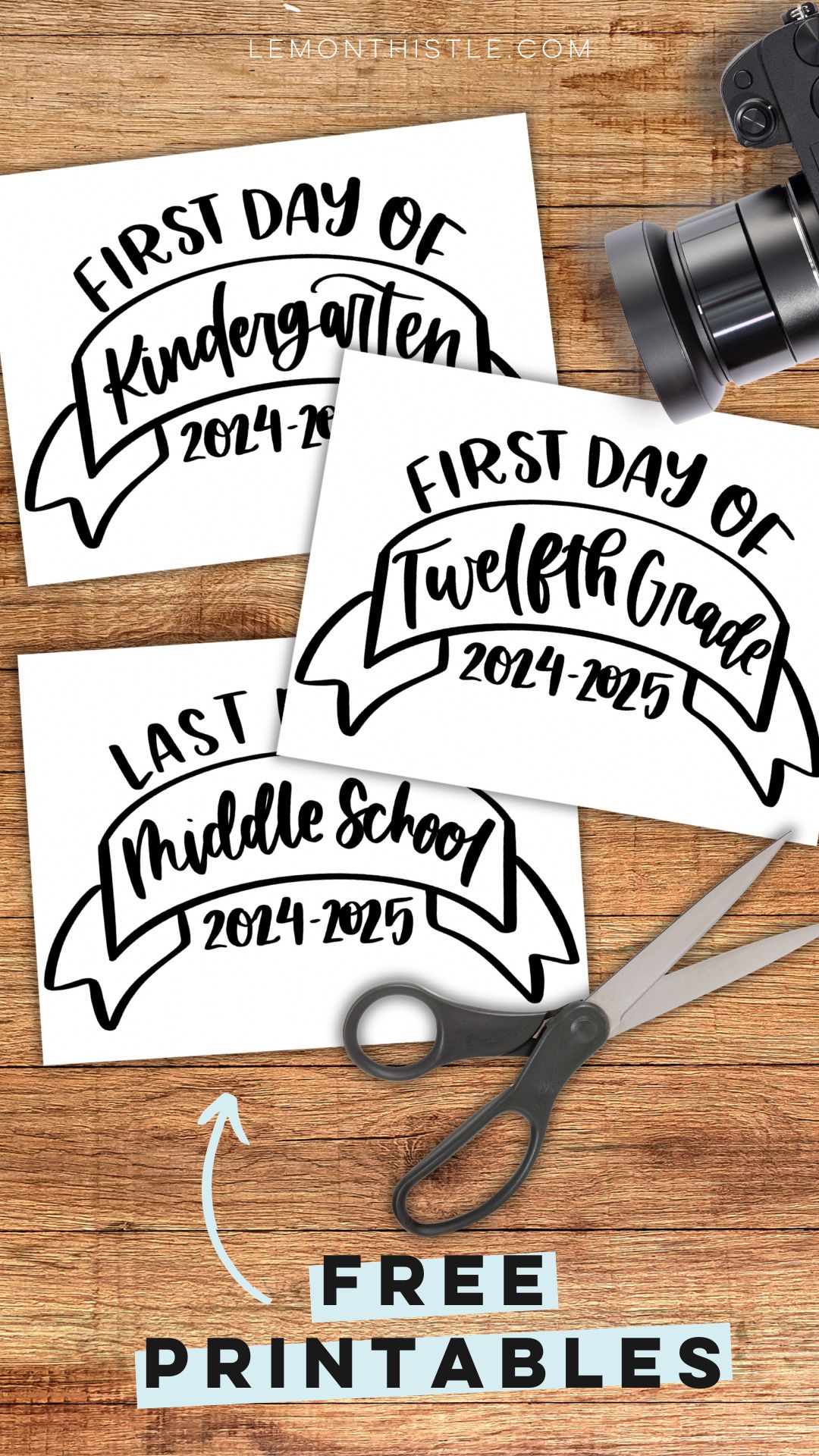 image is a set of printed first day of (school year) signs on a wood table beside camera and scissors. text over reads free printables (from lemonthistle.com)