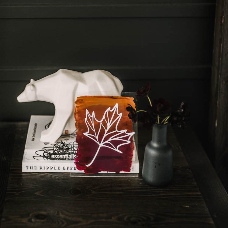 Close up of finished DIY acrylic sign with line art maple leaf (free sVG)