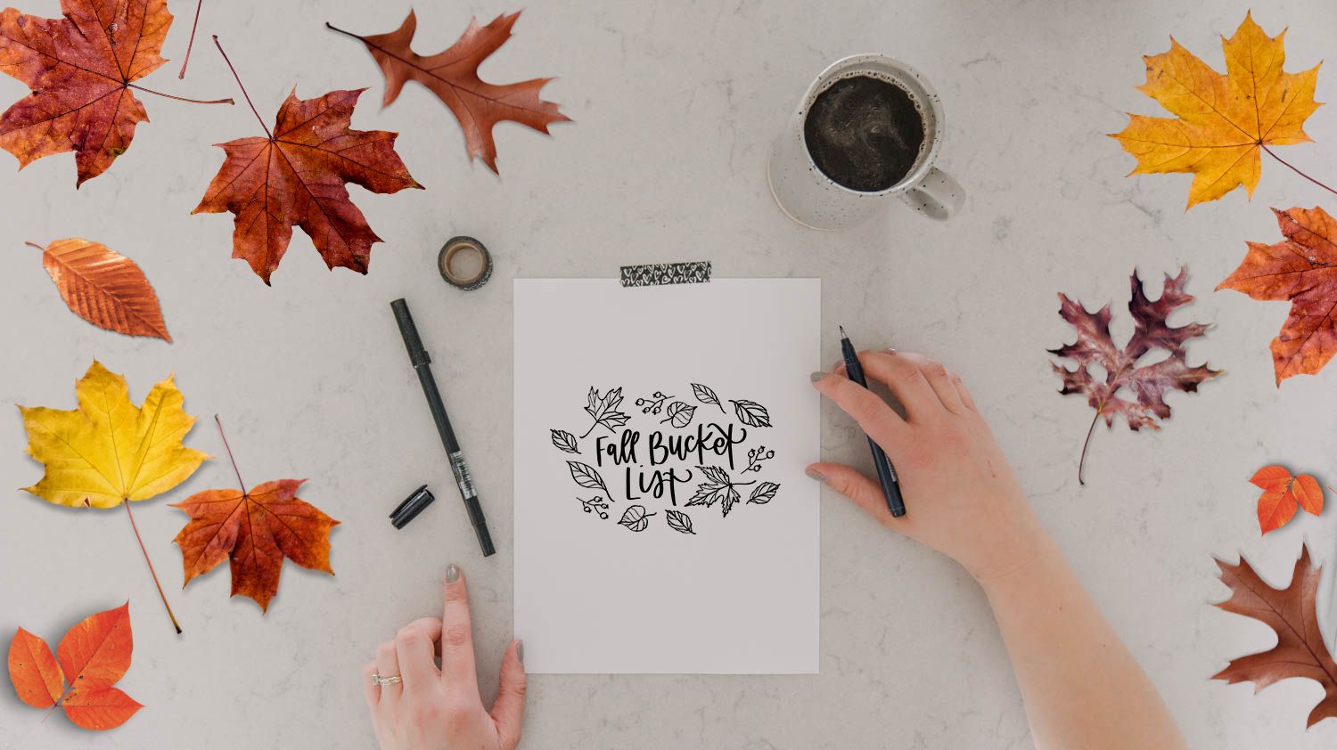 Free Printable Fall bucket lists with ideas (image of printed bucket list template and hands ready to fill in the list