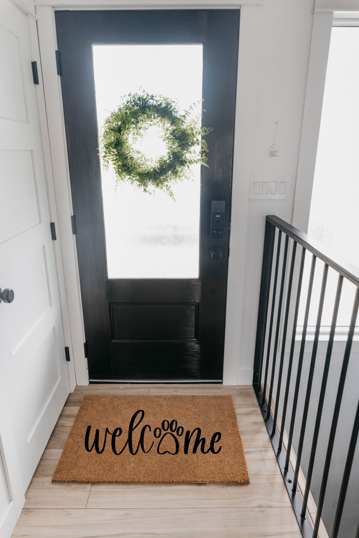 DIY Welcome coir door mat with paw print inside a front door