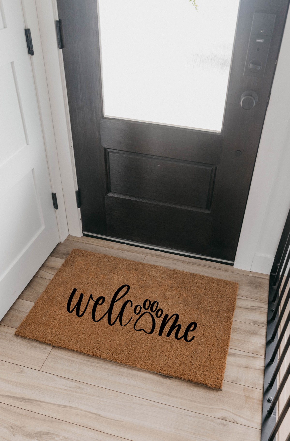 DIY Welcome coir door mat with paw print inside a front door