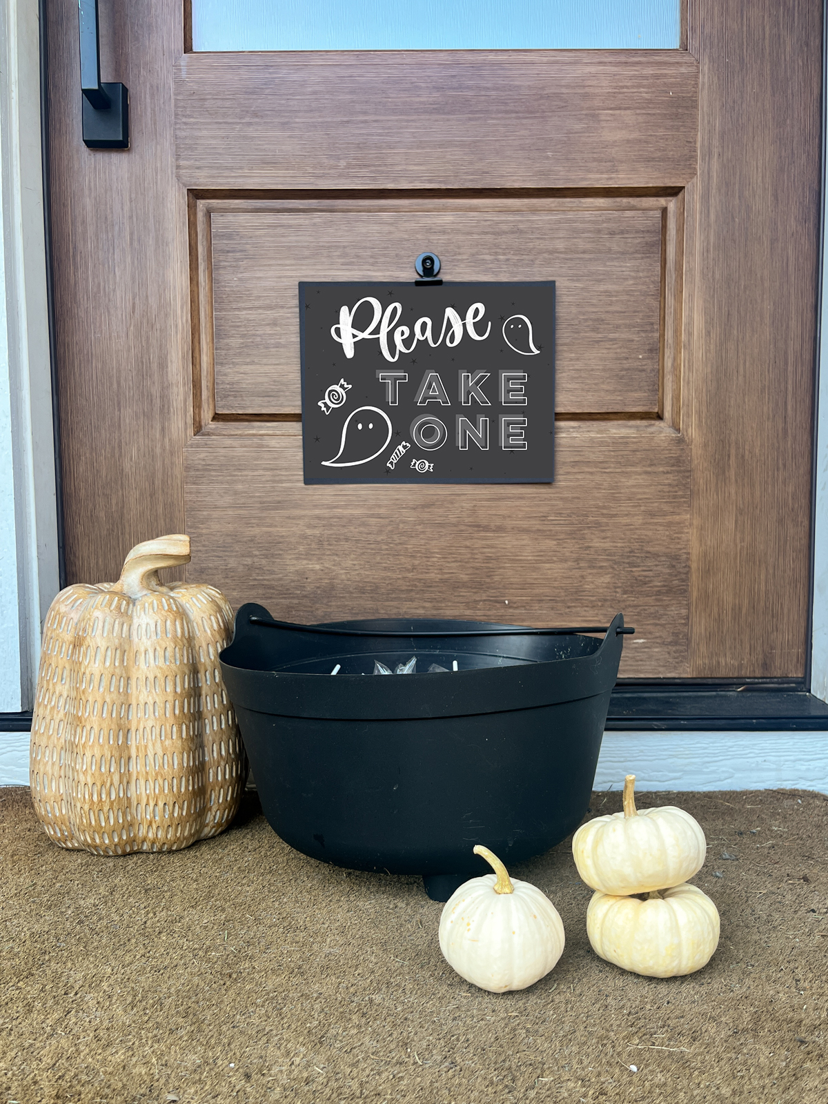 Please take one printable sign for halloween candy (shown on door in front of a cauldron of candy)