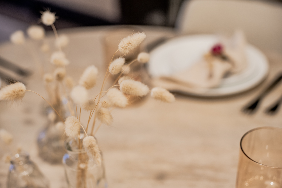Bunny tail grasses in collected vases for a simple thanksgiving table