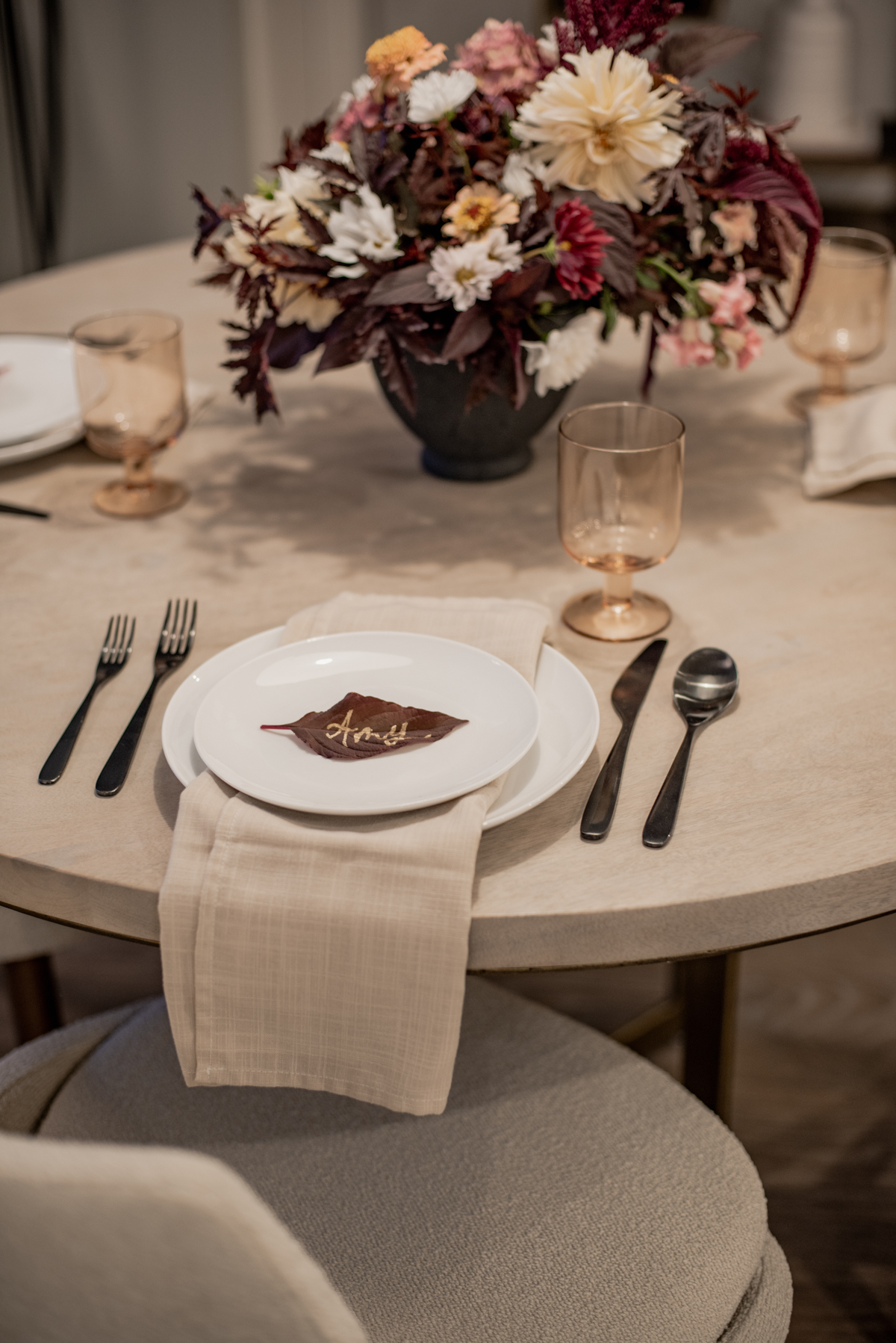 Simple autumn tablescape with a moody fall foliage centerpiece
