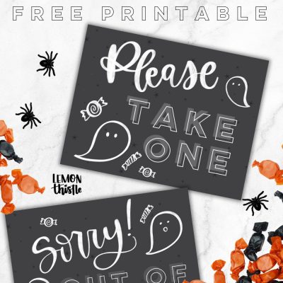 Free printable halloween candy signs, image of signs on a countertop with halloween candy. signs read: please take one and sorry out of candy