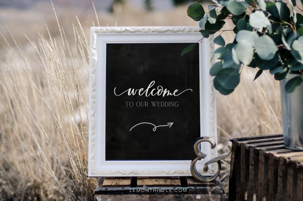 welcome wedding sign with arrow on chalkboard