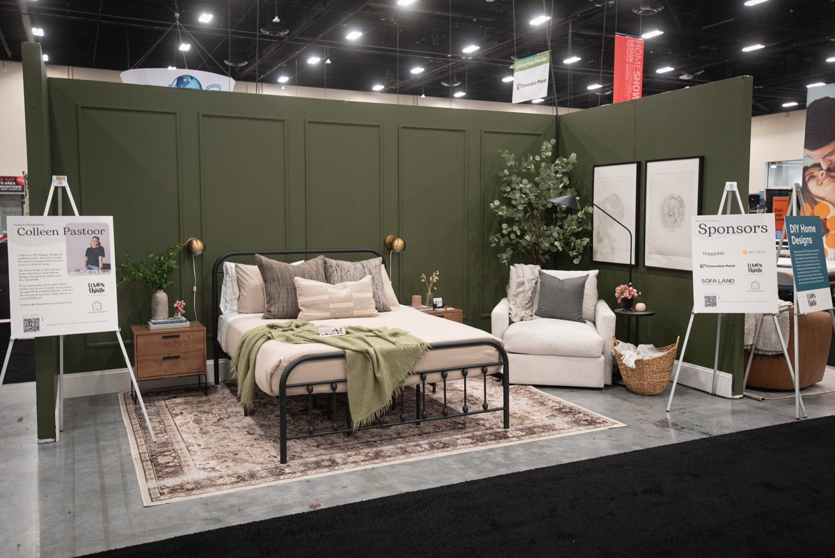 Dark green moody bedroom design- olive toned walls with picture frame moulding and modern classic furniture