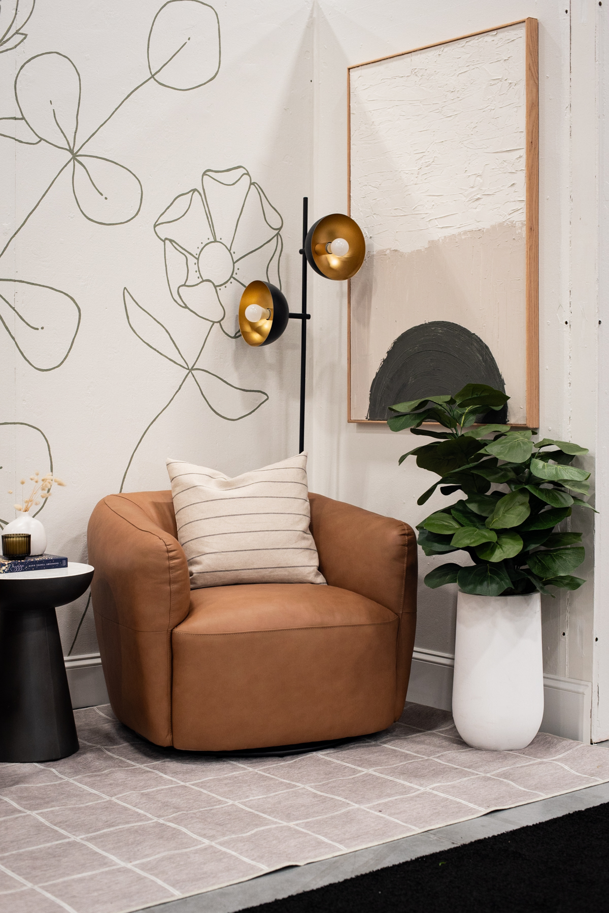 cozy seating area with faux leather chairs and tons of DIY art.