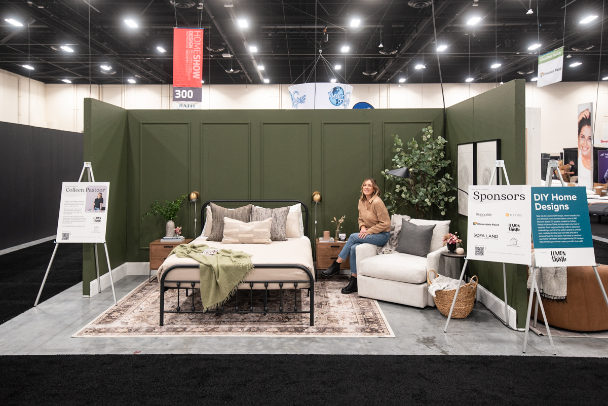Dark green bedroom feature with picture frame moulding wall at the calgary home show