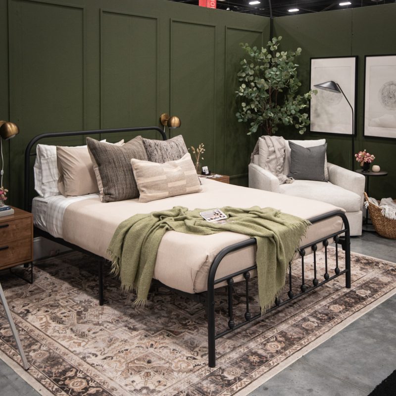 Cozy green bedroom with DIY wood round prints