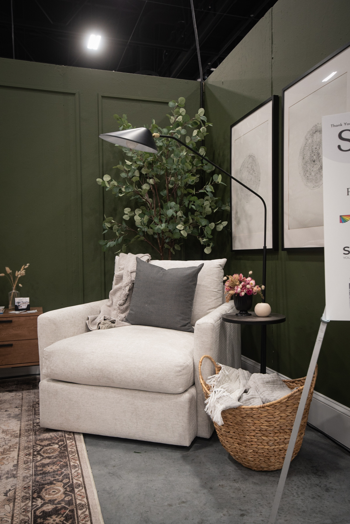 Cozy reading area in a green bedroom design