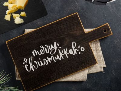 Free Chrismukkah SVG file shown on wooden serving board