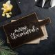 Free Chrismukkah SVG file shown on wooden serving board