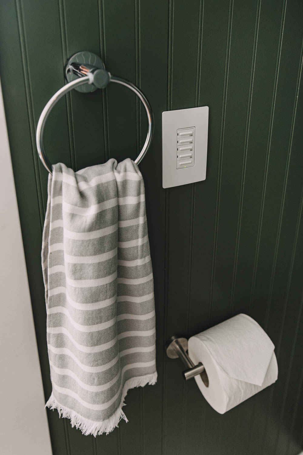 diy green bathroom makeover- dark green beadboard with chrome fixtures