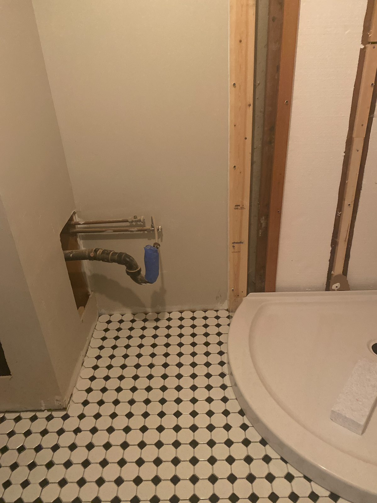 DIY bathroom remodel progress photo- tile installed and shower base installed