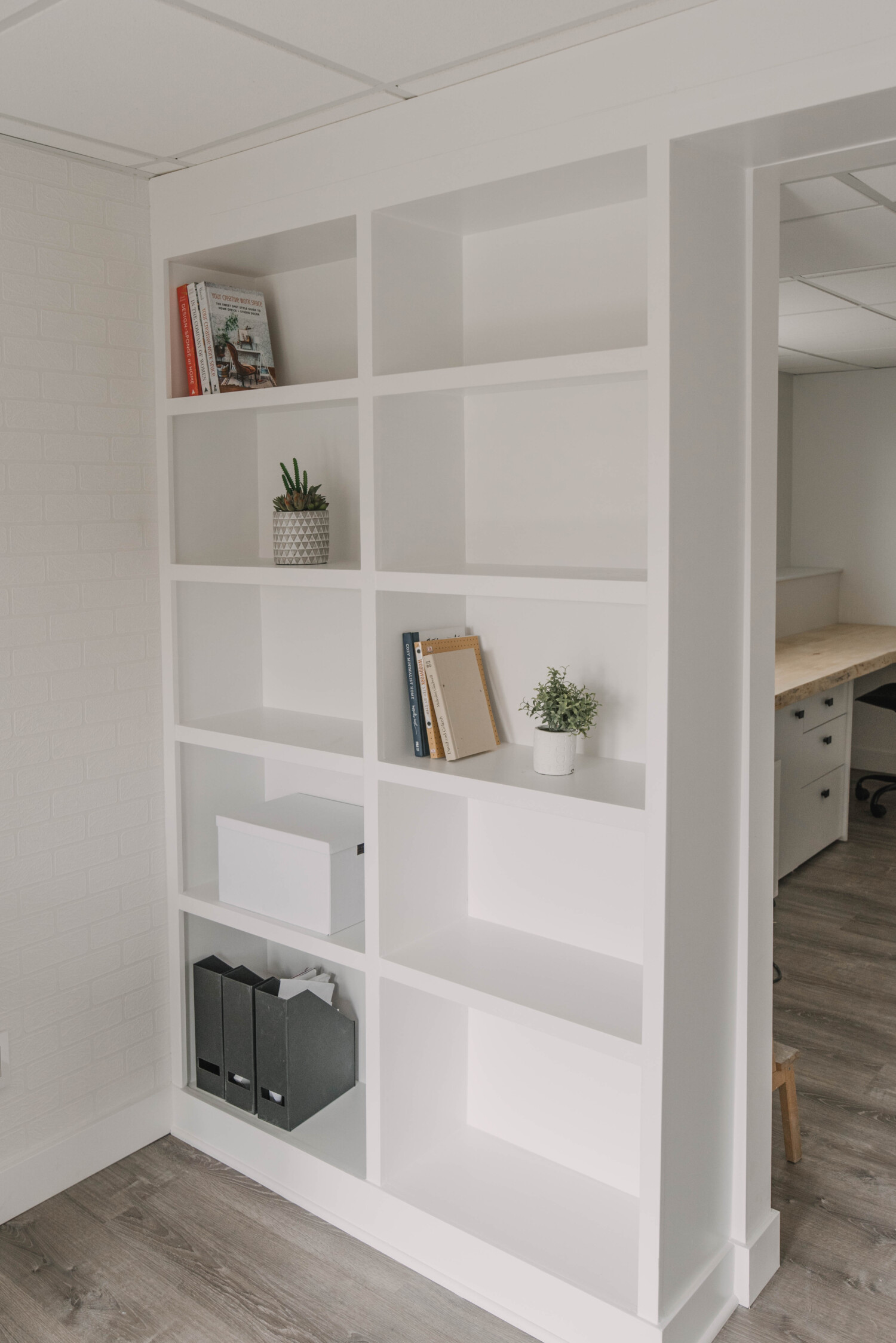 image of built in shelving painted out white - built with MDF image from blog post thats a introduction to the types of wood available for DIY projects