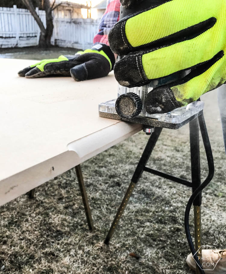 image of MDF panel being routered for a cabinet face