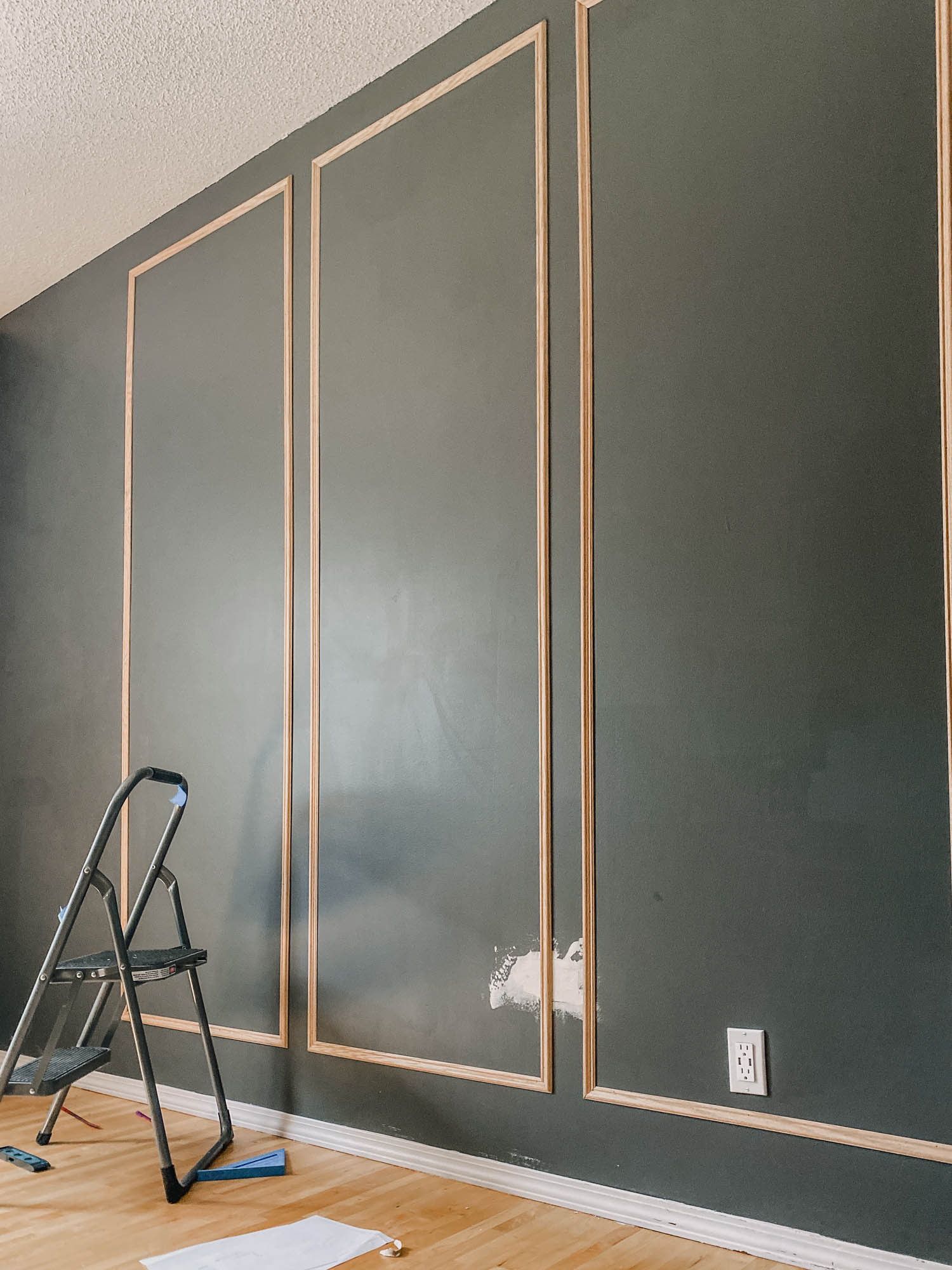 image of thin decorative wood moulding applied on wall but not not filled or painted yet