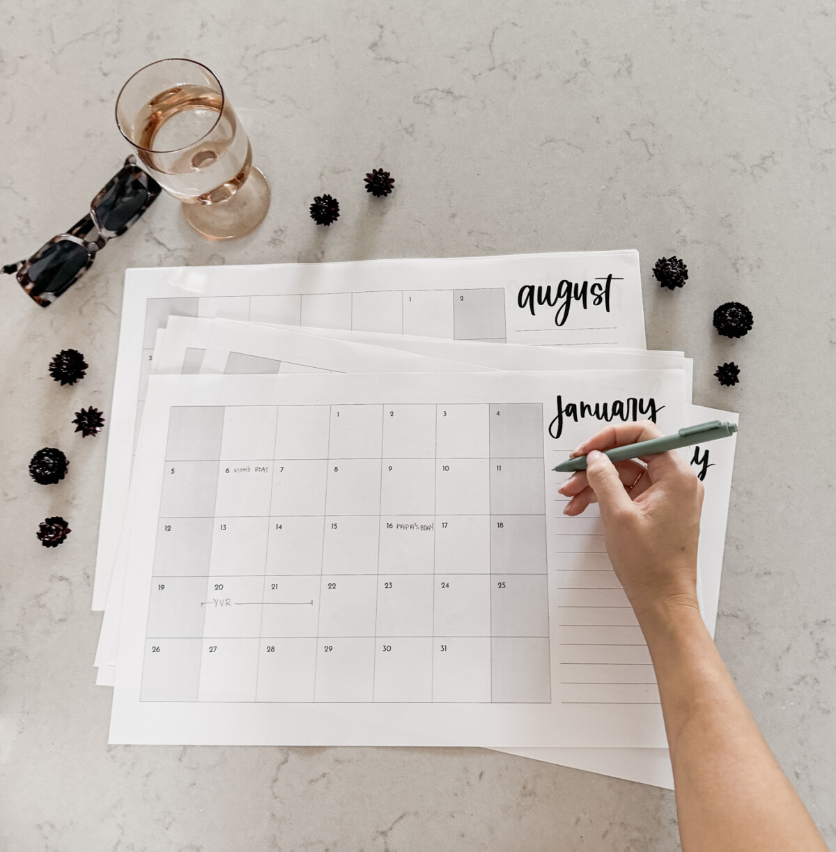 large format monthly calendar for 2025 free printable simple design for family calendars, image showing printed january calendar being written on